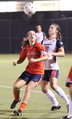 Junior midfielder Katy Frierson beats a Samford opponent to the ball. Frierson had two shots and two assists in the game. (Emily Adams / PHOTO EDITOR)