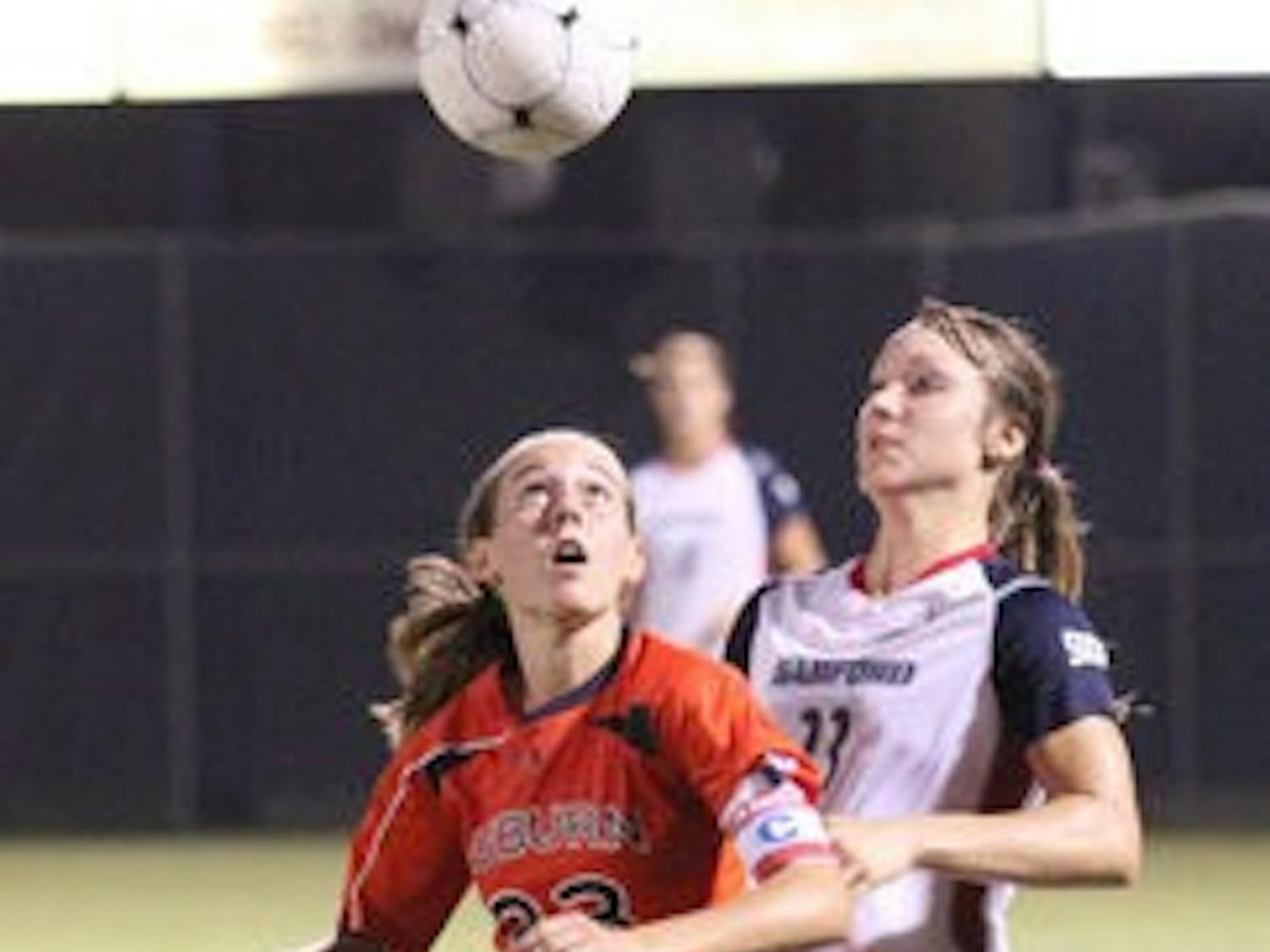 Junior midfielder Katy Frierson beats a Samford opponent to the ball. Frierson had two shots and two assists in the game. (Emily Adams / PHOTO EDITOR)