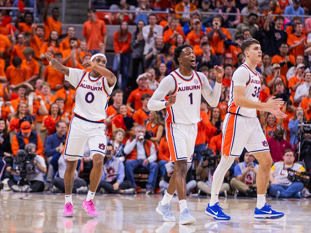 Tahaad Pettiford, Kevin Overton and Filip Jovic celebrate a defensive stop against Alabama on Feb. 7, 2026.