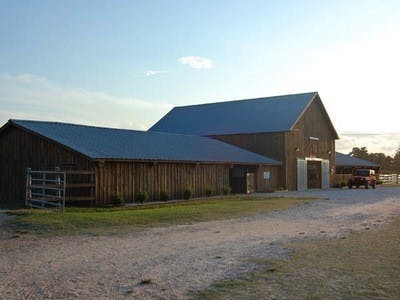 Although practice starts at noon, the athletes usually don't leave until after the sky above the barn has gone dusky.
