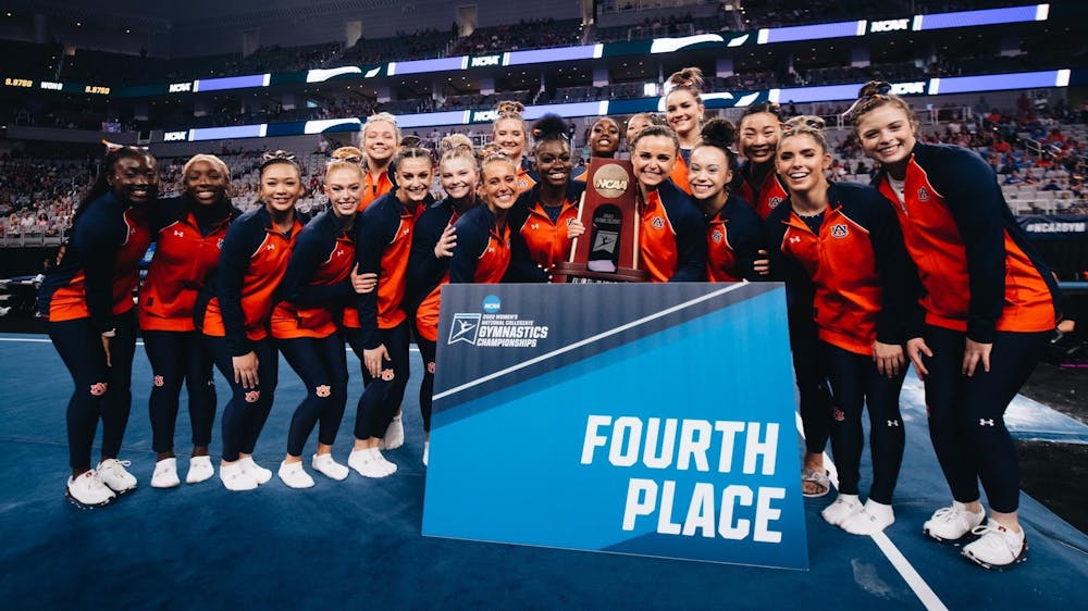Auburn gymnastics celebrates a program best finish at the NCAA Championships in Fort Worth, Texas, on April 16, 2022. 
