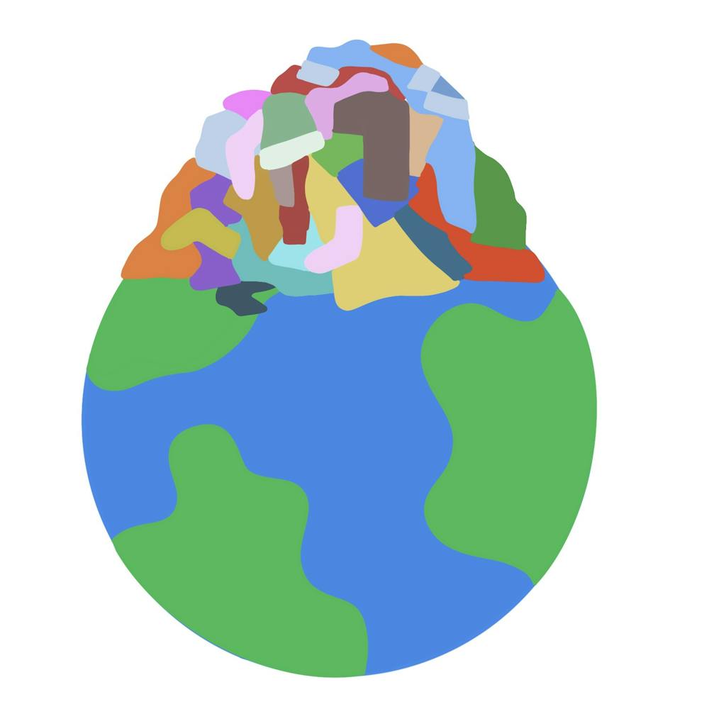 Graphic of earth with a pile of clothes on it. 