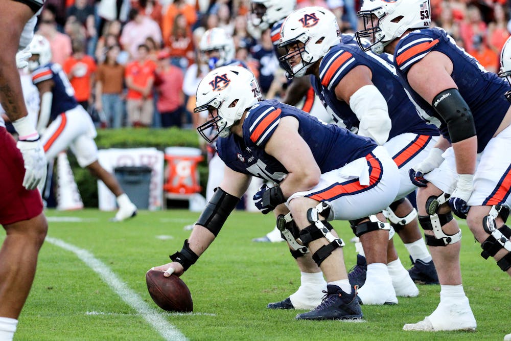 Auburn center Conner Lew (75) waiting to snap ball in game against New Mexico State in Jordan-Hair Stadium on Nov. 18, 2023.