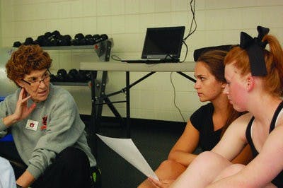 Pam Wiggins (left to right) teaches her students Laurel Hicks, junior in nutrition and dietetics, and Mackenzie Horsefield, freshman in exercise science, about different rhythm concepts for Group Fitness Instructor Training.