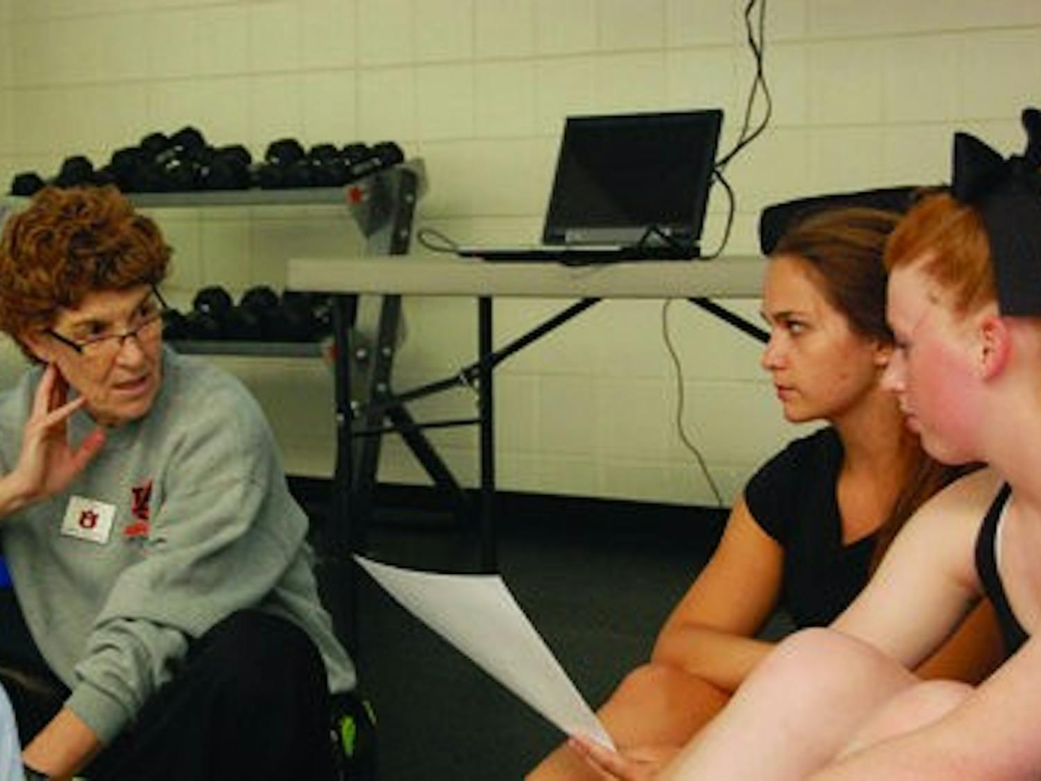Pam Wiggins (left to right) teaches her students Laurel Hicks, junior in nutrition and dietetics, and Mackenzie Horsefield, freshman in exercise science, about different rhythm concepts for Group Fitness Instructor Training.