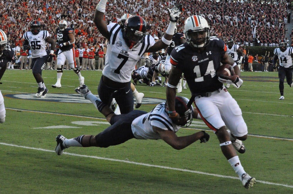 Nick Marshall runs the ball against Ole Miss. Anna Grafton / PHOTO EDITOR