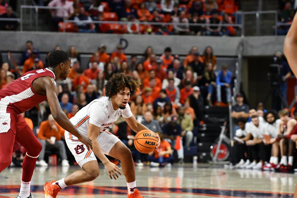 <p>Auburn guard Tre Donaldson (3) dribbles a basketball in the game against Arkansas in Neville Arena on Jan. 7, 2023.</p>