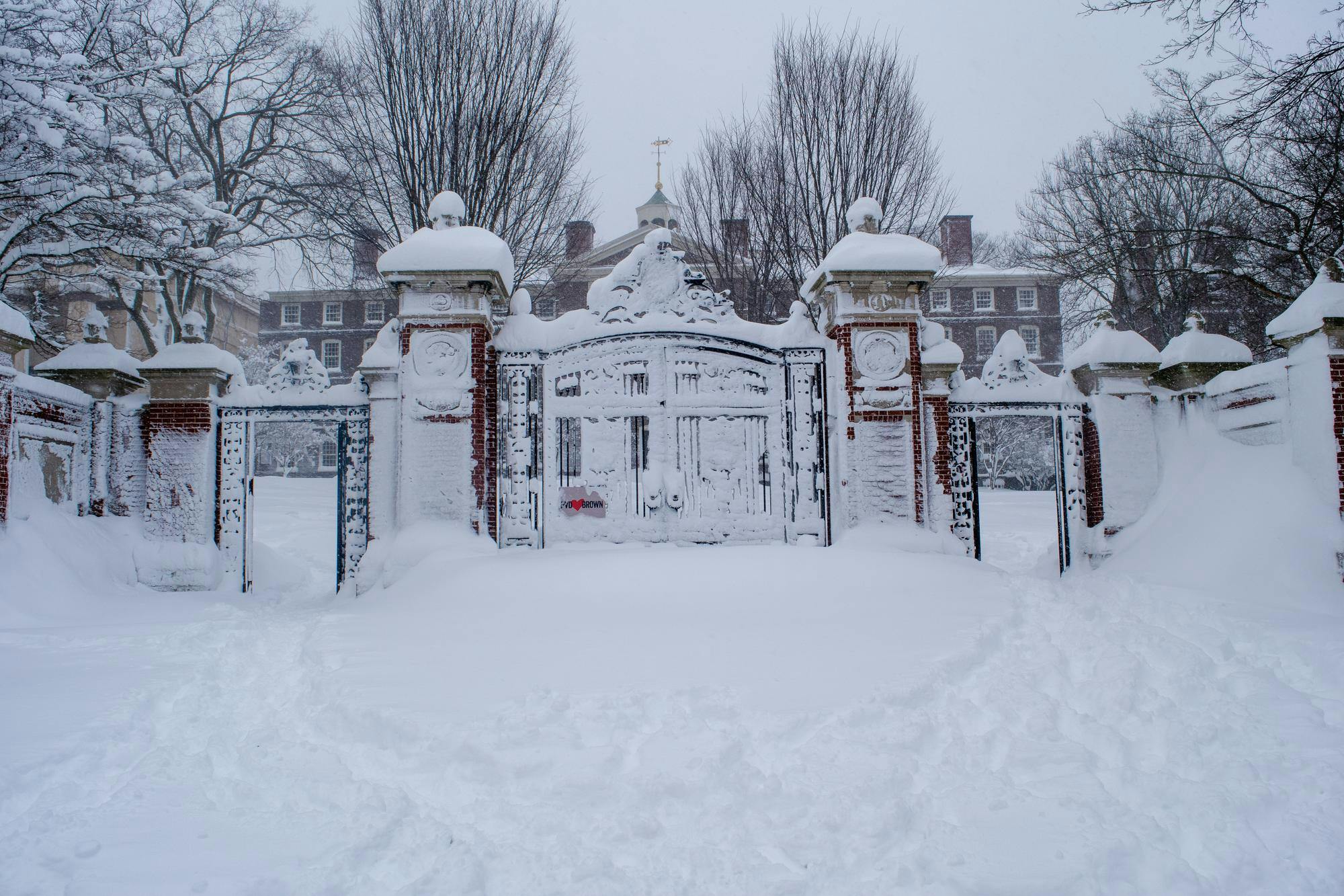 A photo of the Van Wickle Gates covered in tall piles of snow. 
