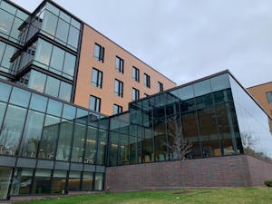 Photo of a modern building with many large windows.

