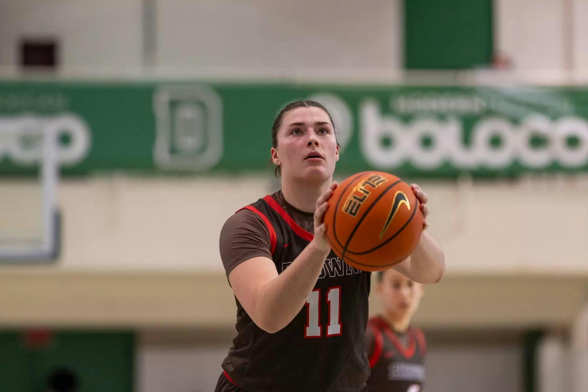Brown women's basketball player prepares to shoot a free-throw.