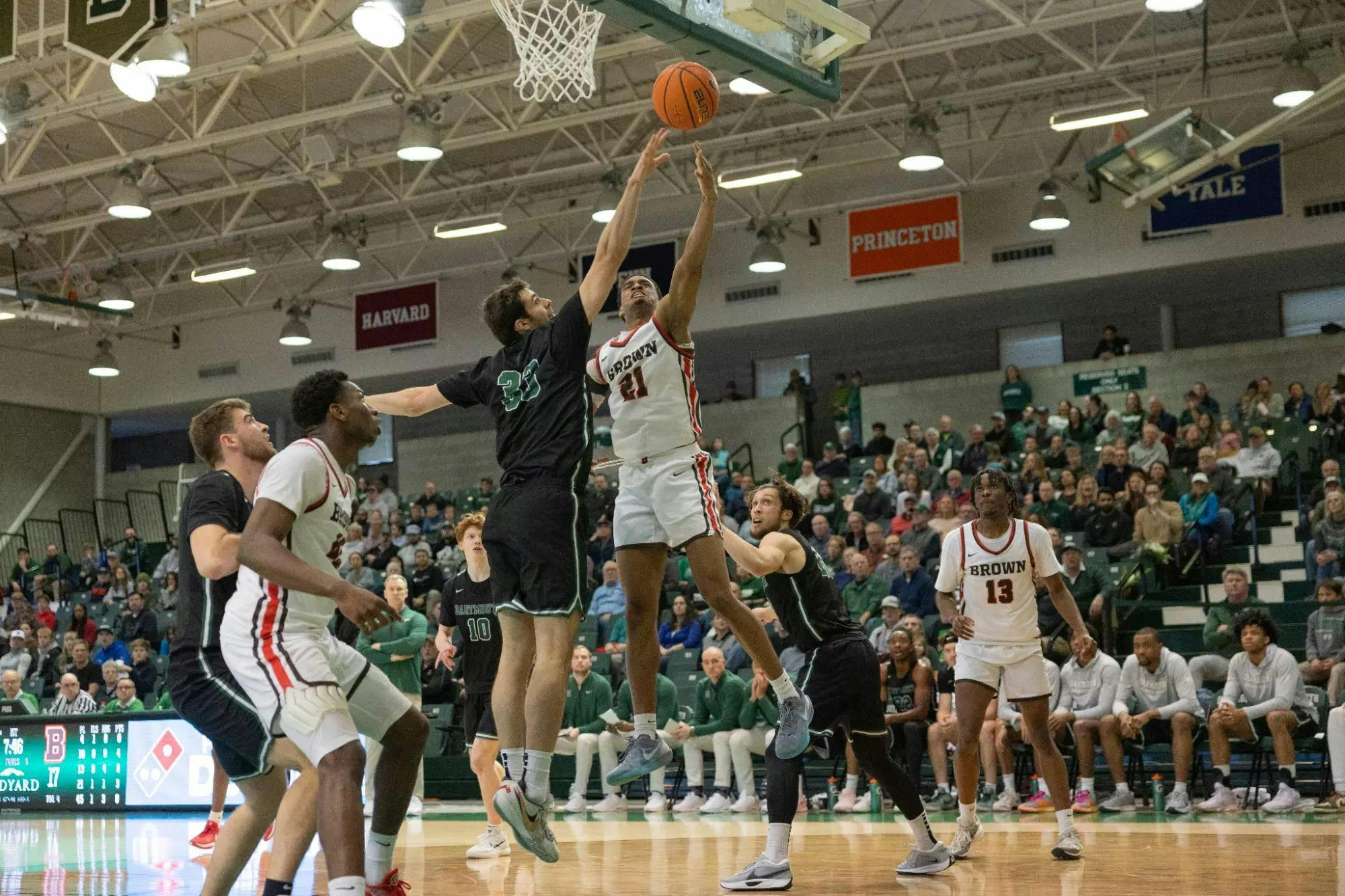 Aaron Cooley '25 takes a shot over a Dartmouth defender.