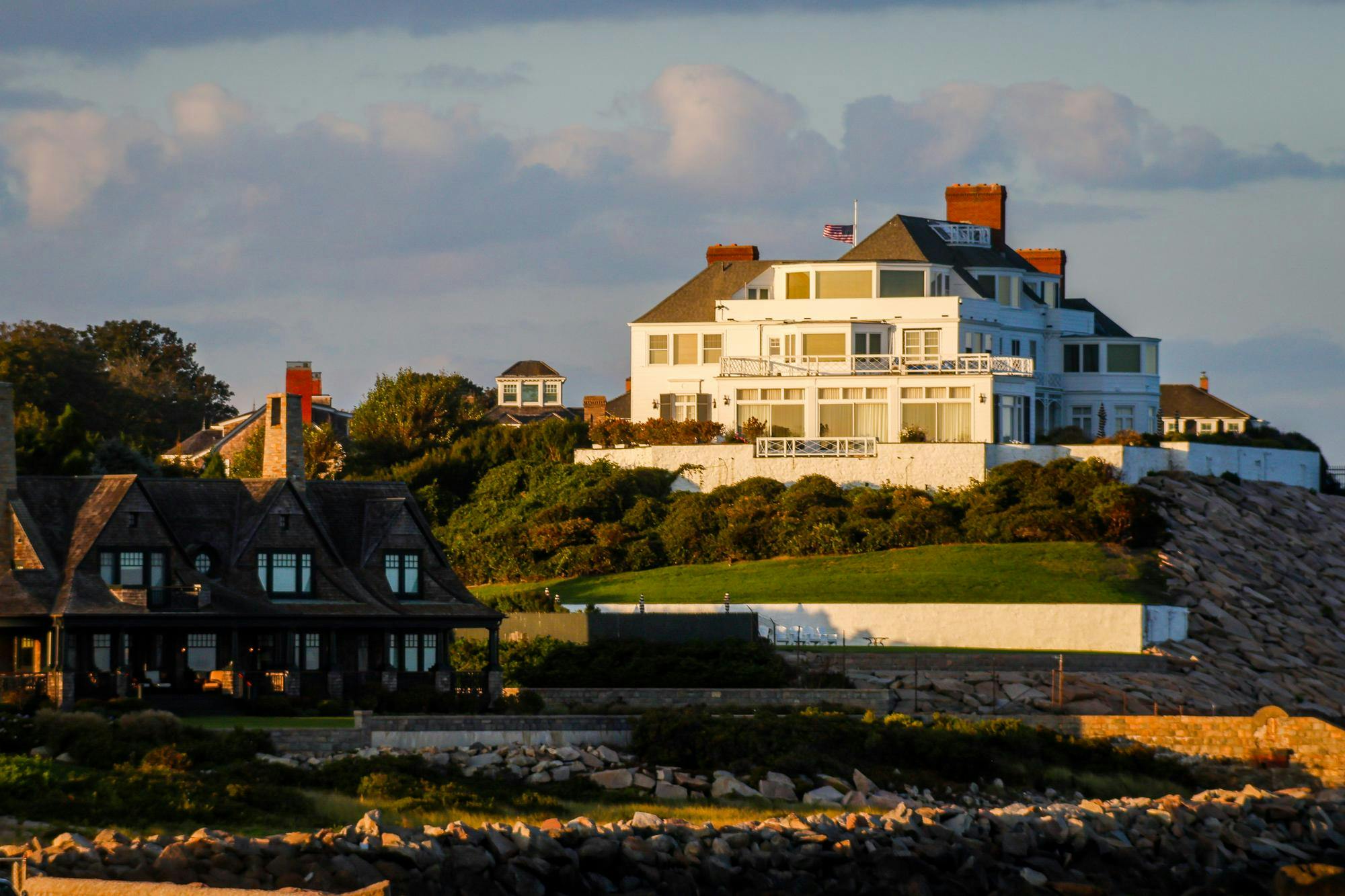 Photograph of Taylor Swift's Watch Hill mansion at sunset.