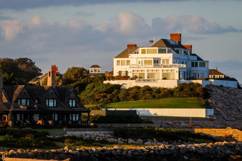 Photograph of Taylor Swift's Watch Hill mansion at sunset.