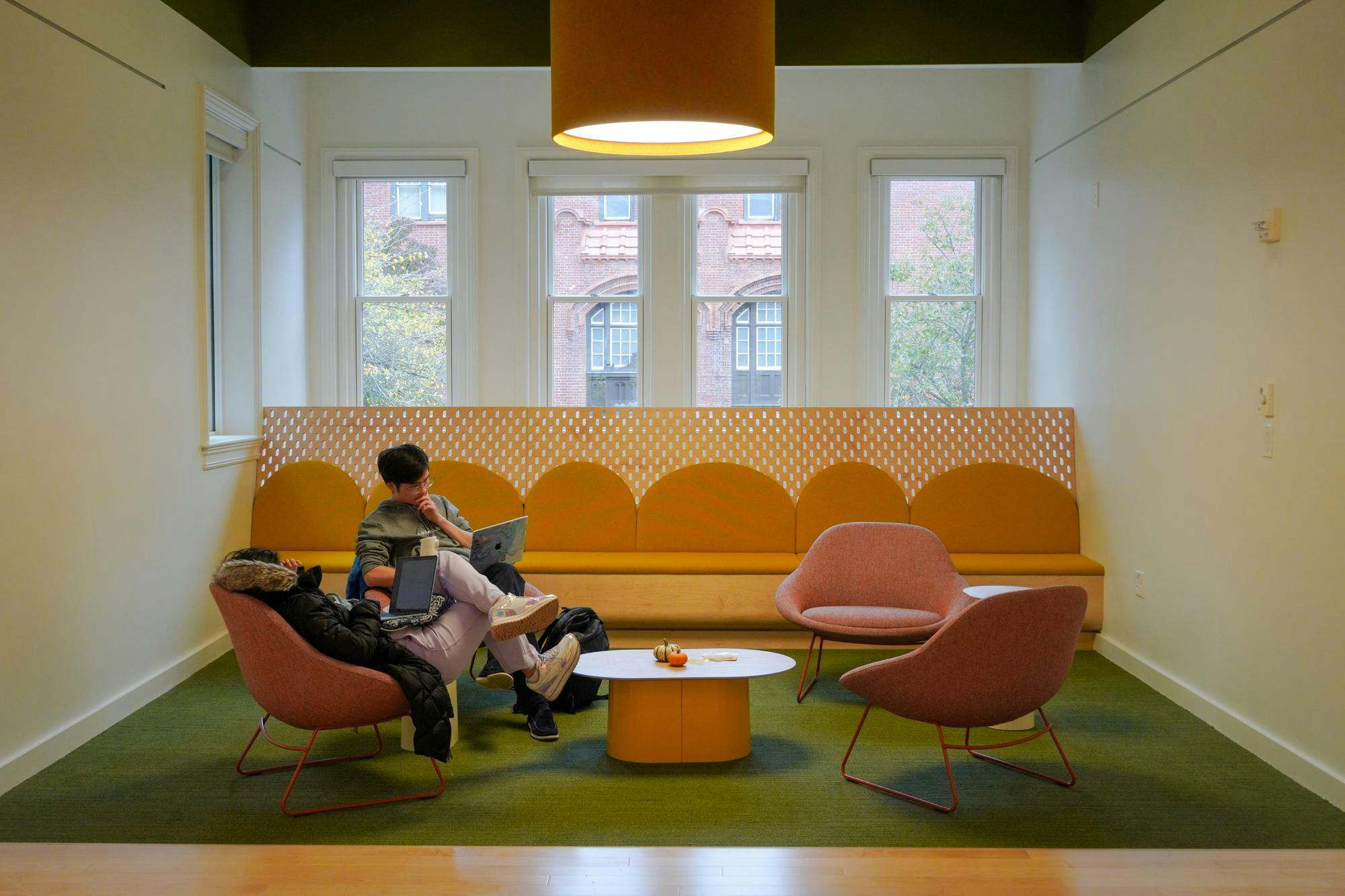 Lounge in the Pembroke Center with students sitting in chairs
