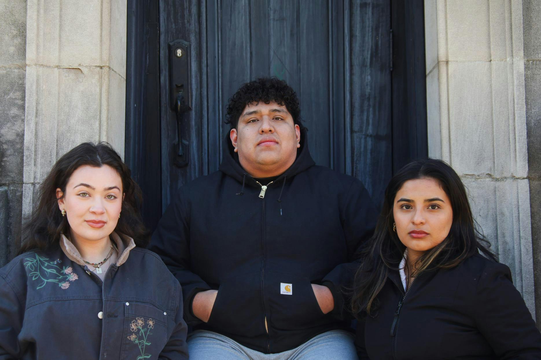 Image of three people looking into the camera.