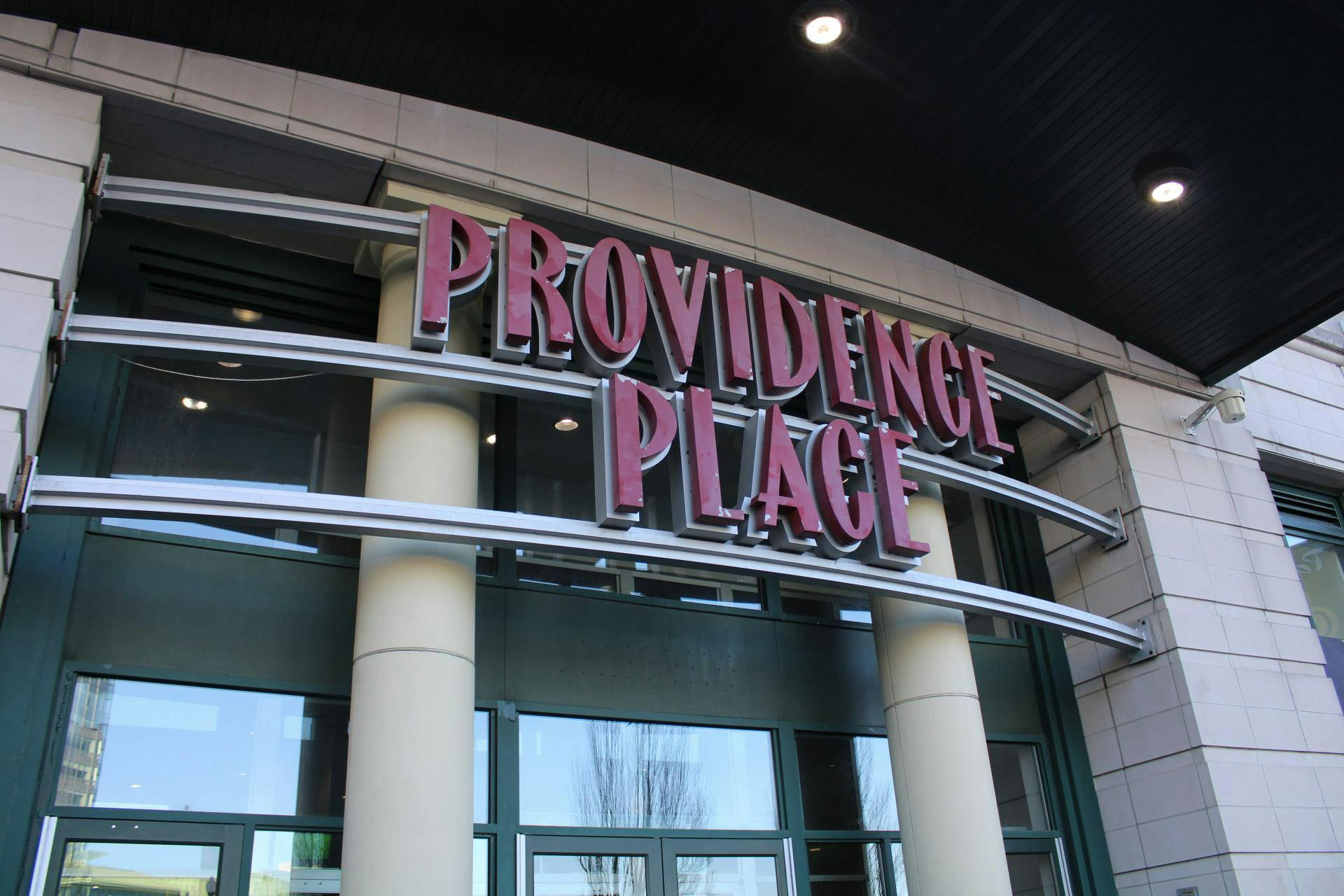 A photo of the front doors of the Providence Place Mall with its name above.  
