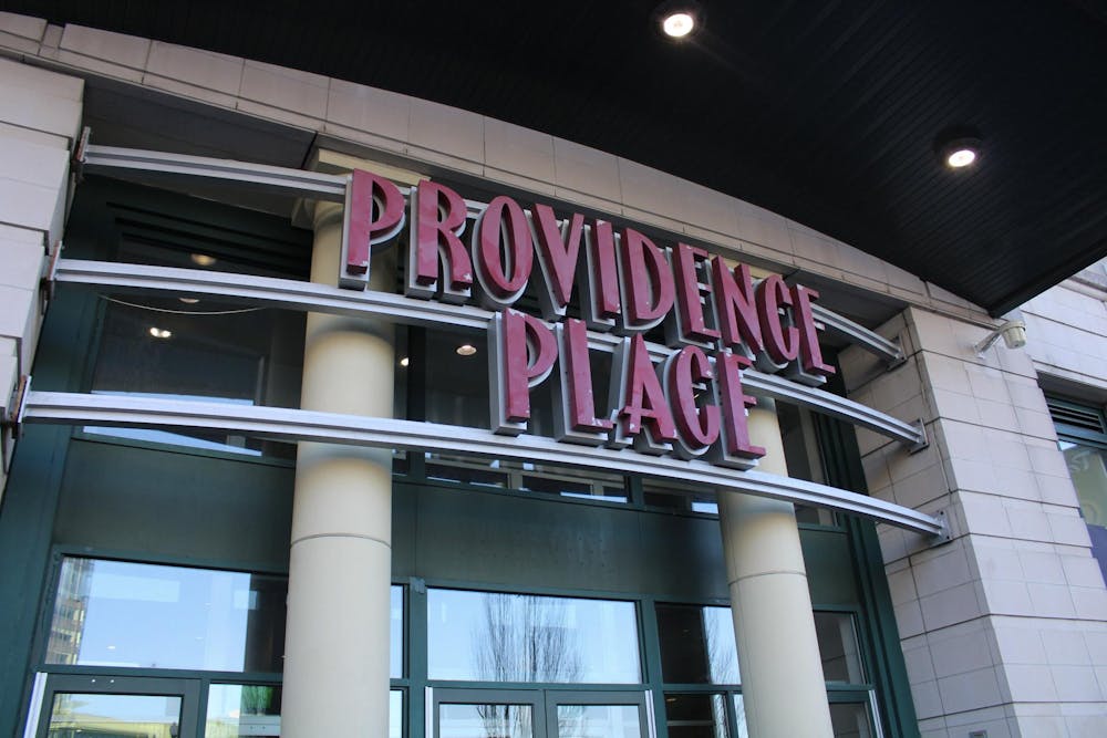 A photo of the front doors of the Providence Place Mall with its name above.  
