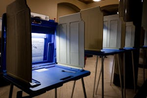 Photo of illuminated voting booths in the Providence City Hall.