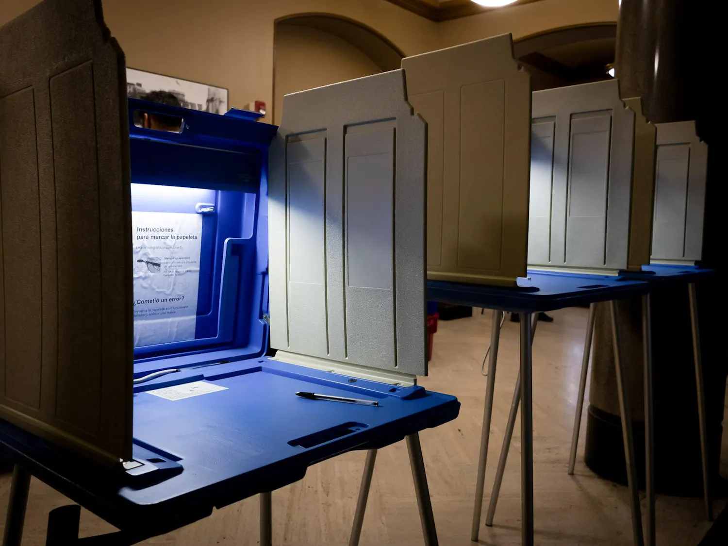 Photo of illuminated voting booths in the Providence City Hall.