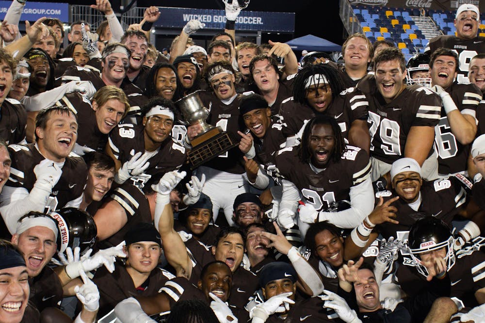 The Bears pose for a celebratory post-game photo holding the Governor's Cup.