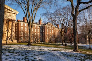 Photo of Brown University’s University Hall as the sun is setting.

