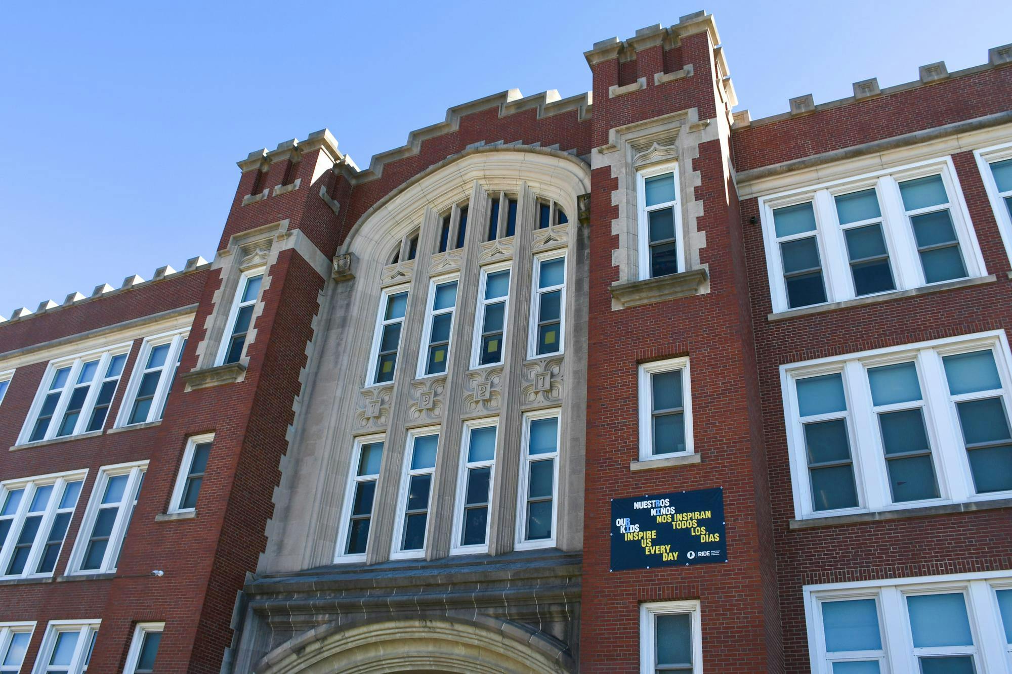 A picture of a brown school building.