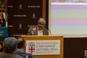 Photo of Steven Levitsky speaking from behind a podium which reads "The Watson School of International and Public Affairs."