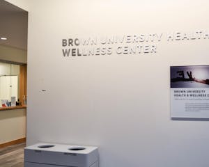 A photo shows the sign of the Student Health and Wellness Center.