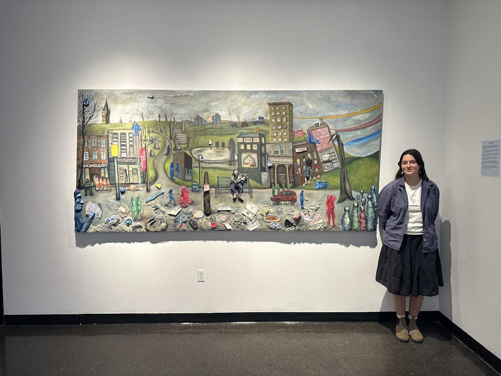 <p>Goodman placed the largest piece of the exhibit, a landscape painting titled “People Make Glasgow,” on the back wall to be the first piece encountered by viewers.</p>