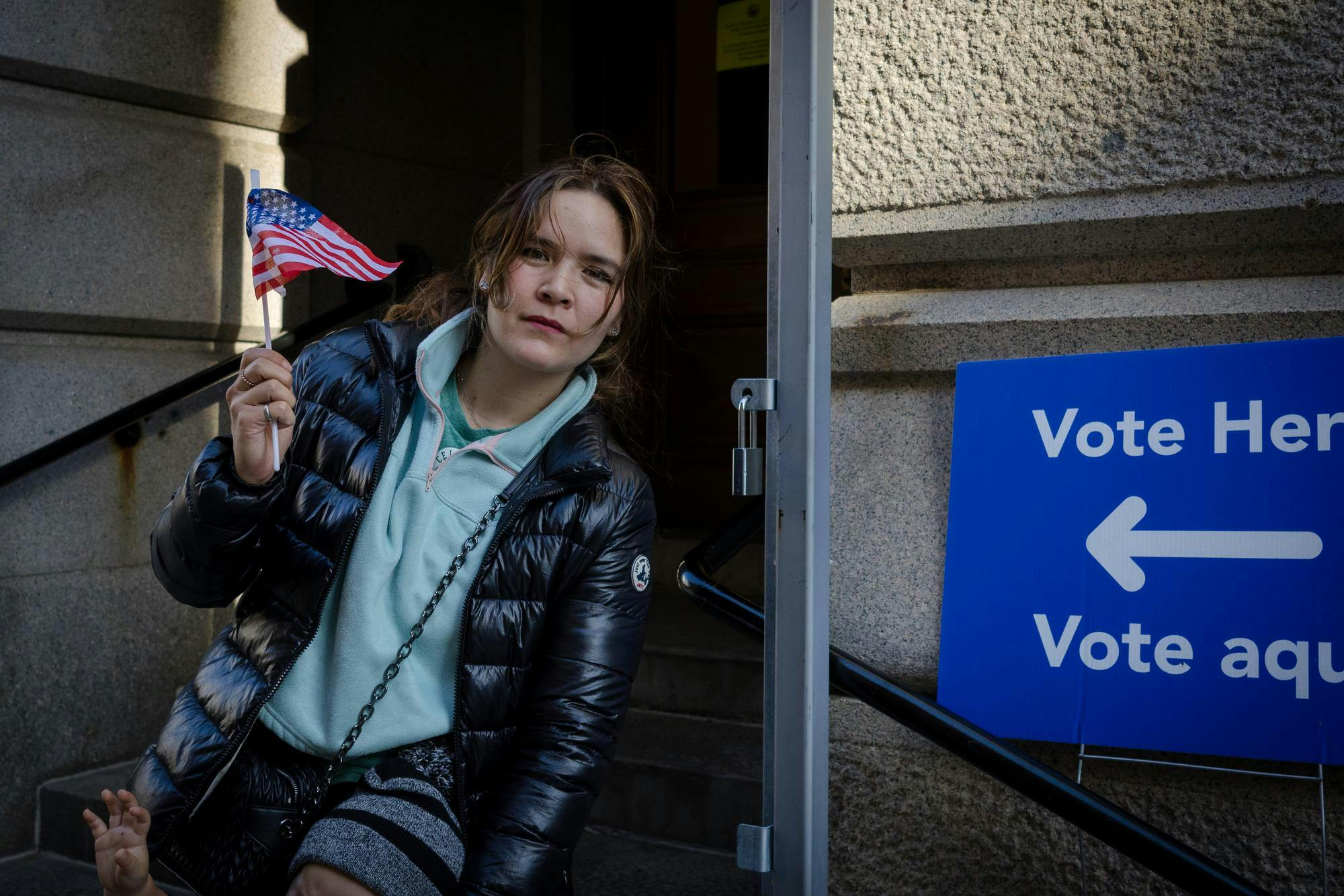 A voter holding an American flag.