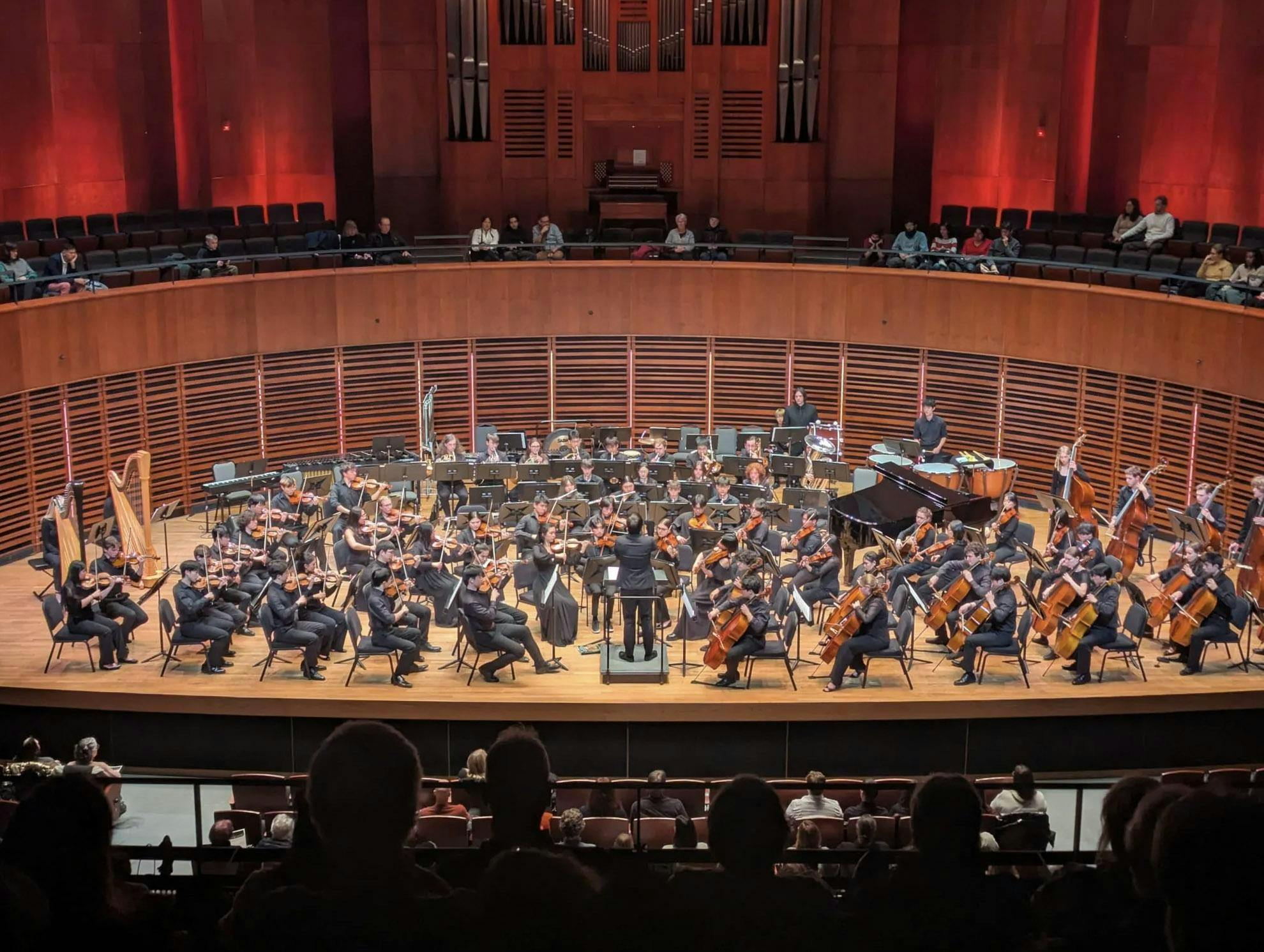 A photo of the Brown University Orchestra performing in front of an audience.