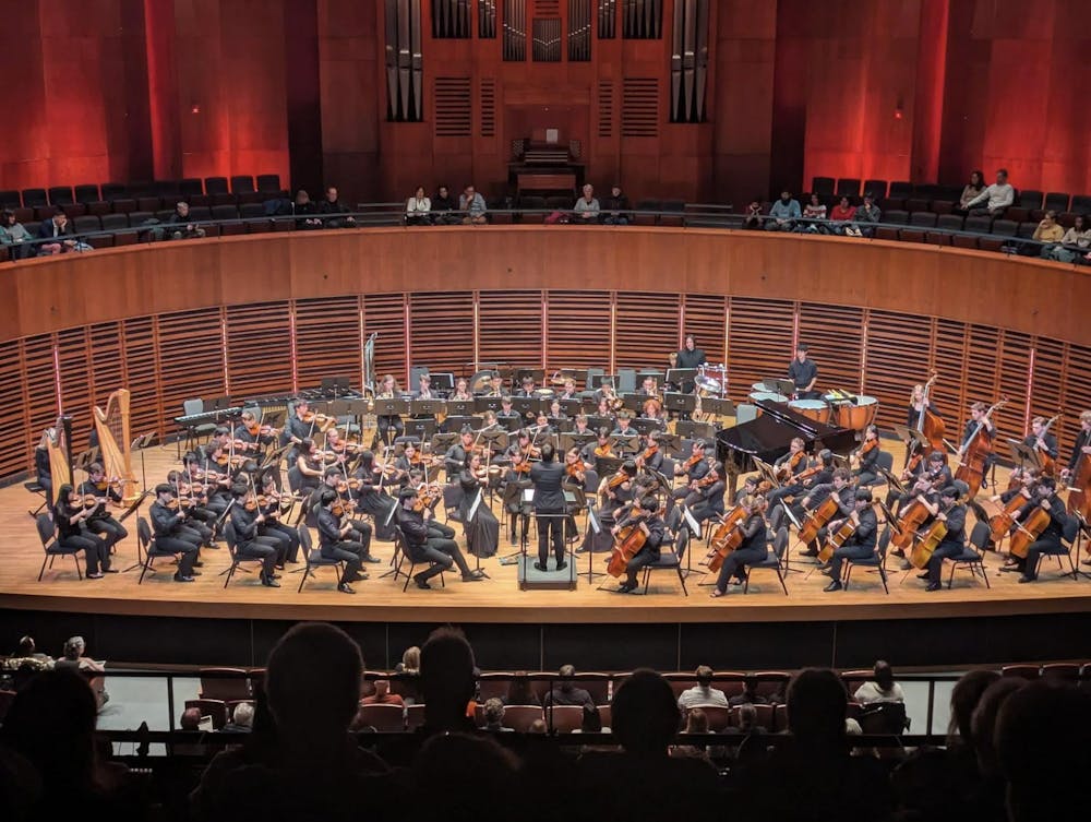 A photo of the Brown University Orchestra performing in front of an audience.