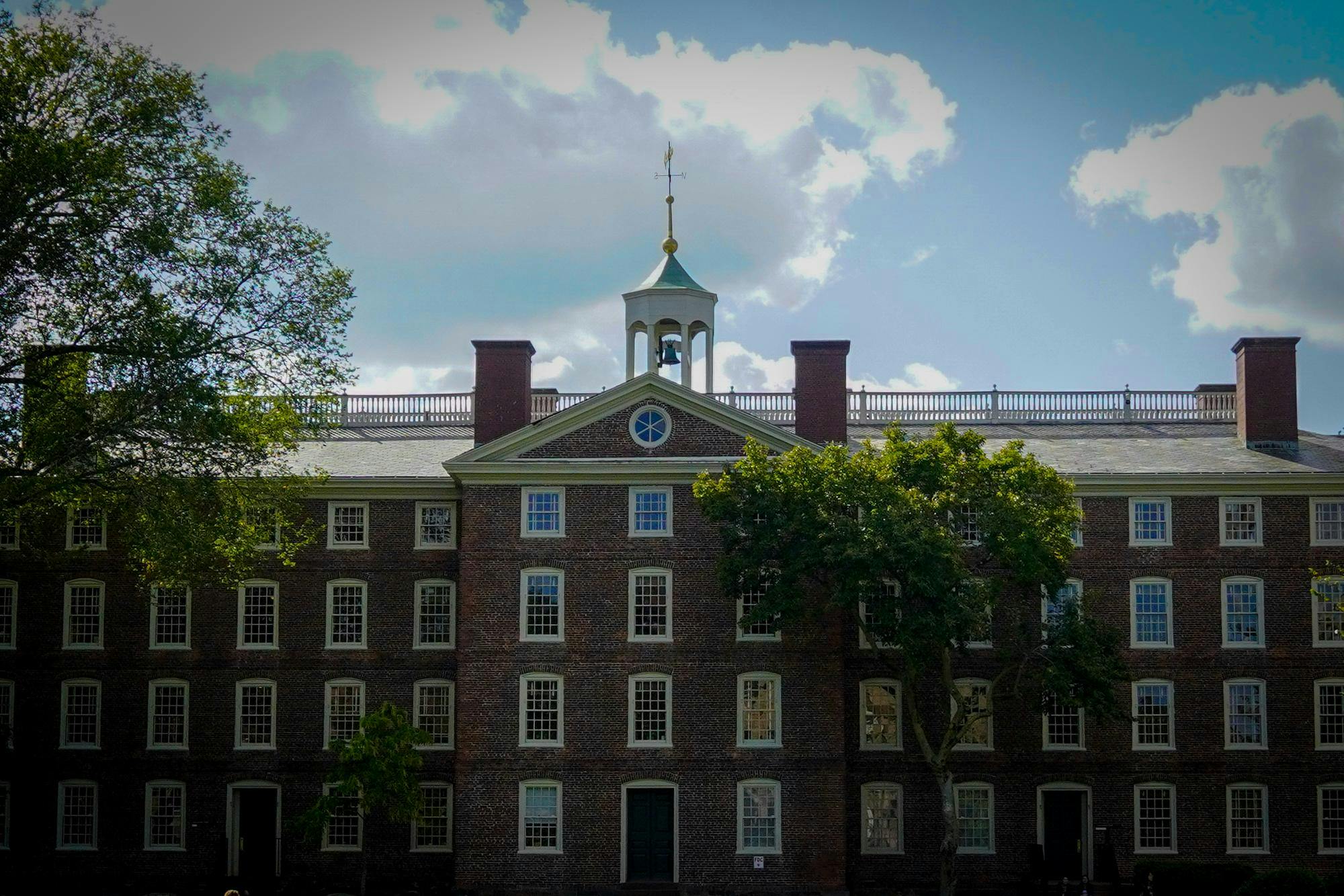 Photo of University Hall with clouds in the background. 