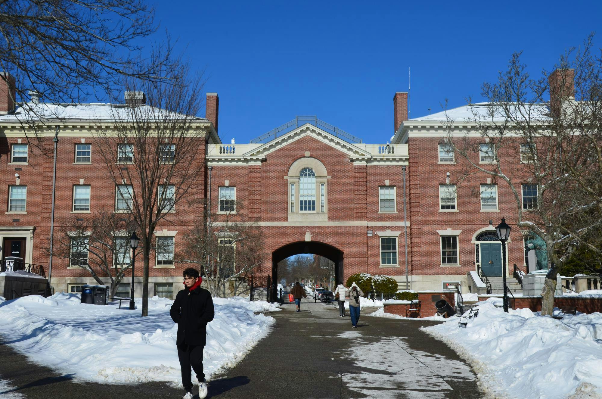 Faunce Arch, a brick building, on a snowy day.