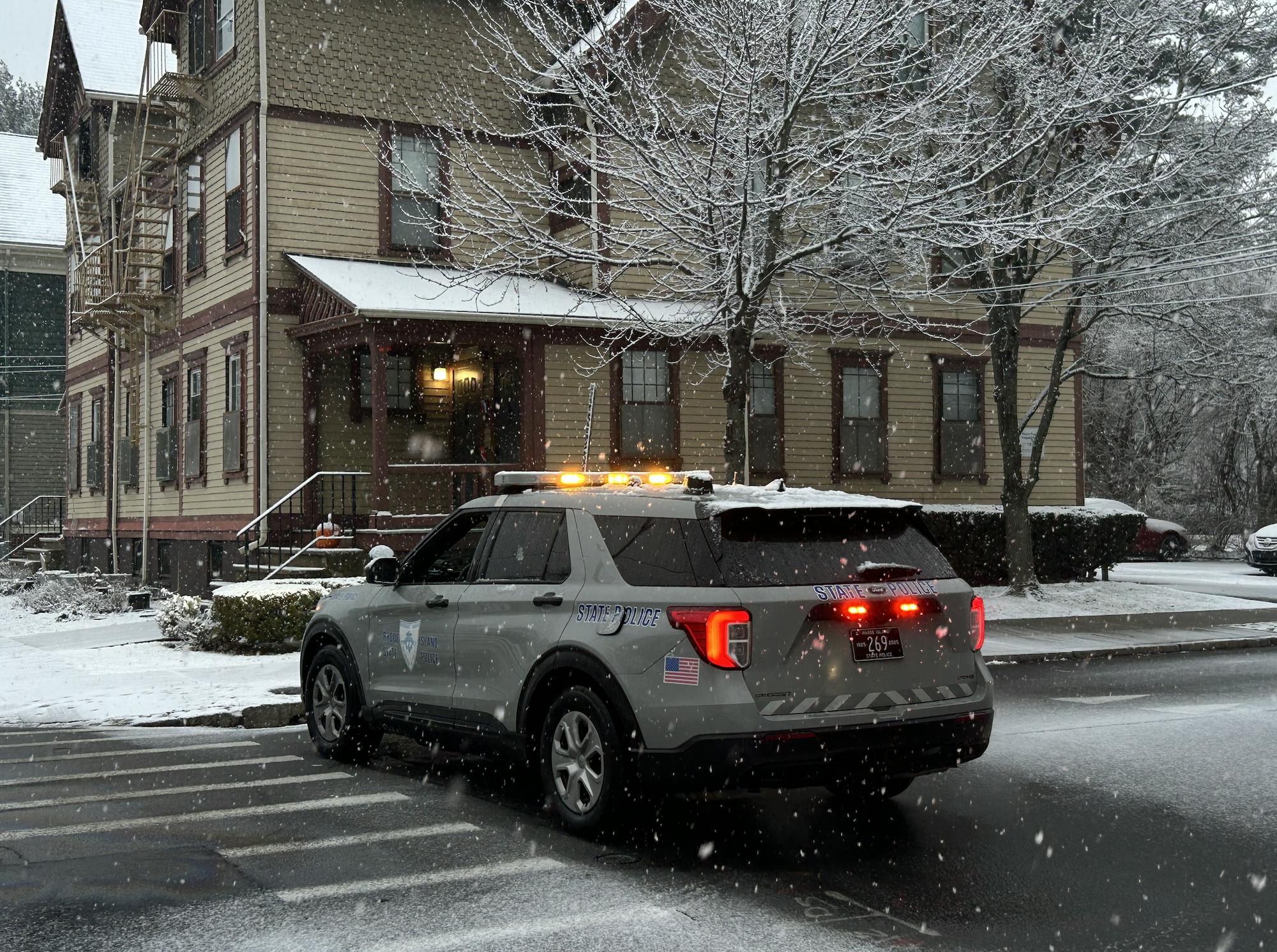 A police car surrounded by falling snow on Dec. 14. 