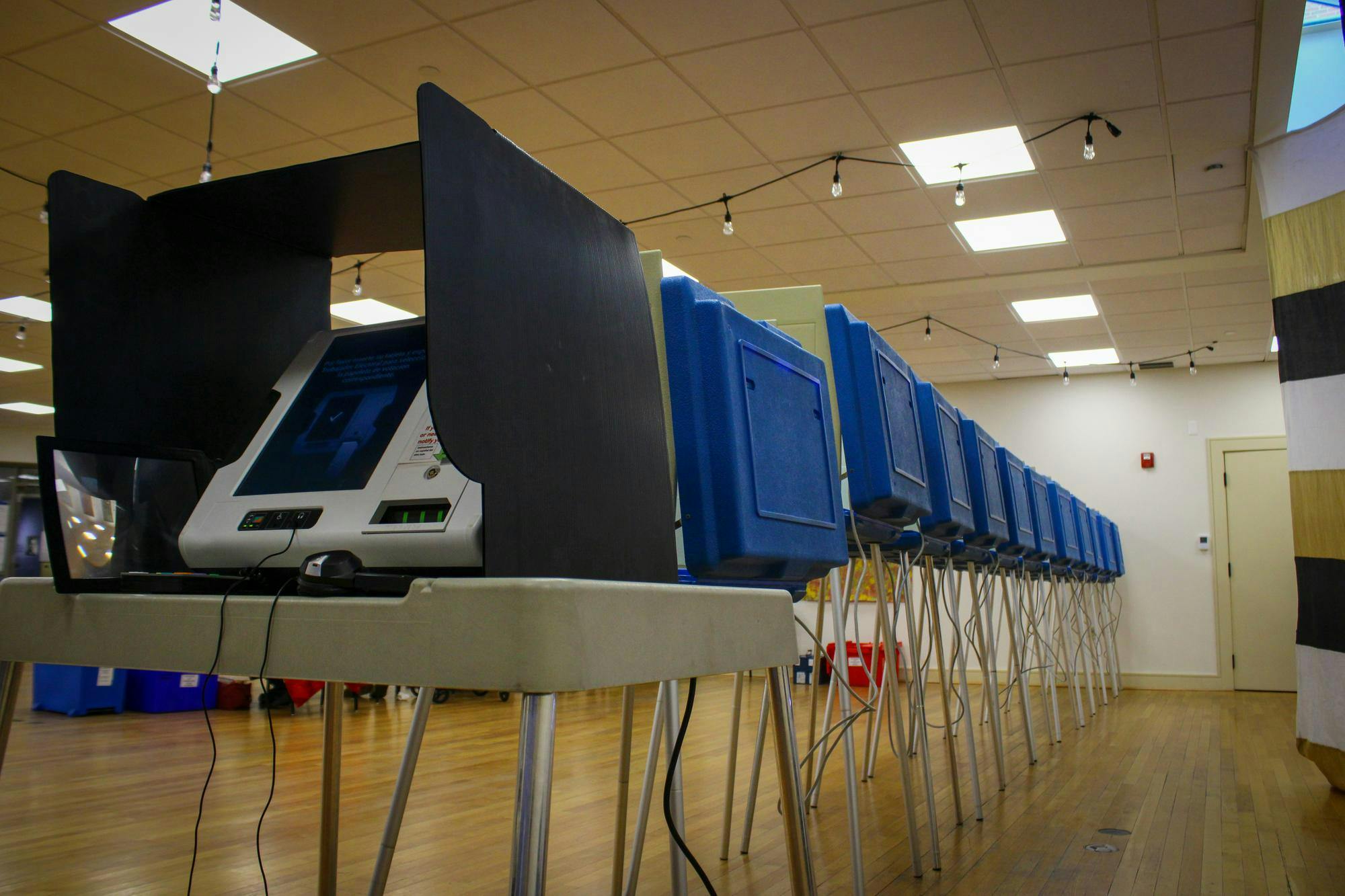 Photograph of a line of polling booths. 