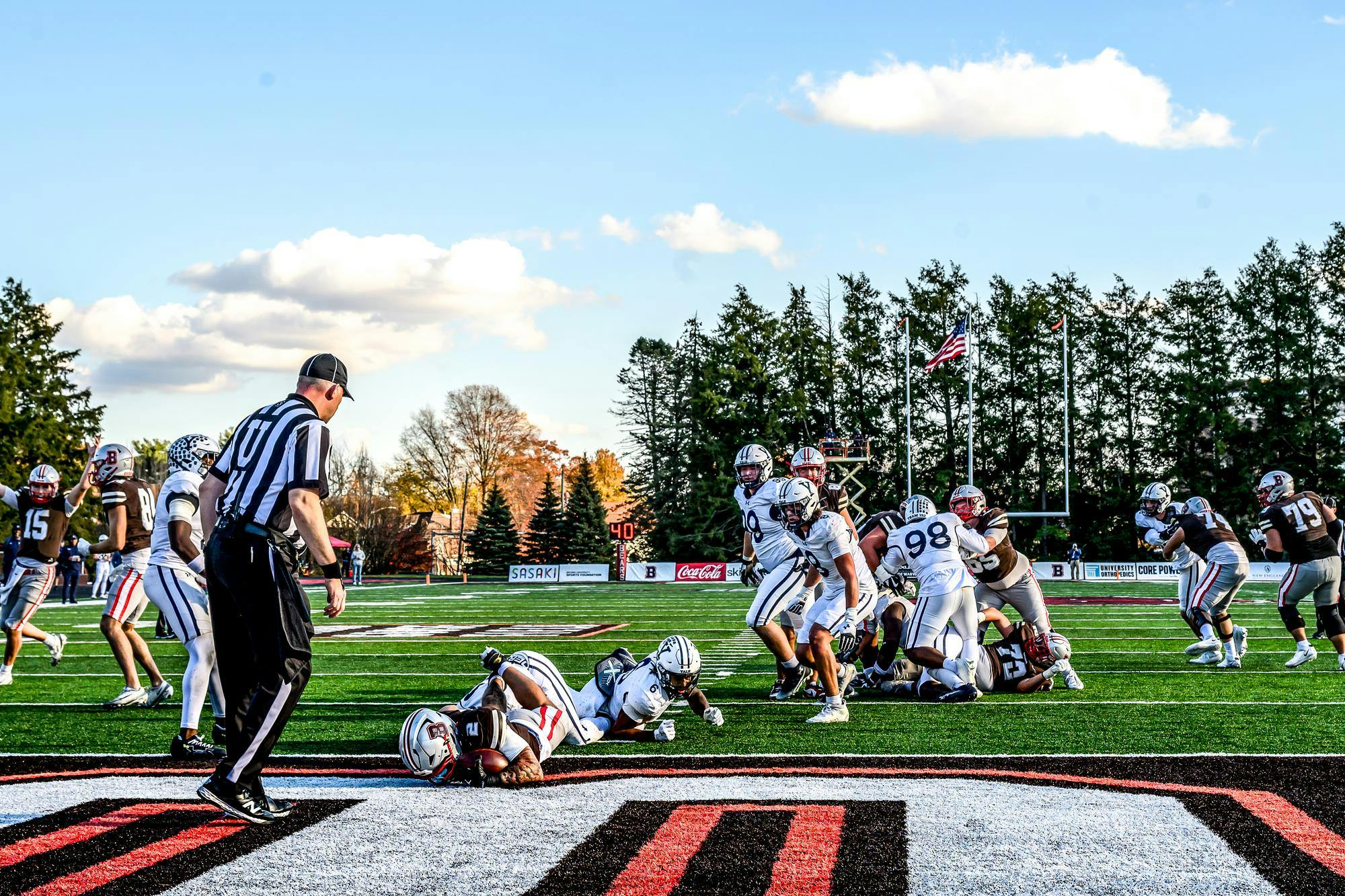 A football player at Yale (unfortunately) is making a touchdown.