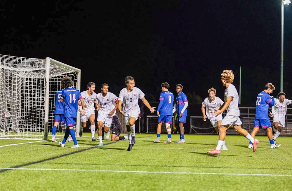 Photo of Brown players celebrating after scoring in their match against UMass Lowell.