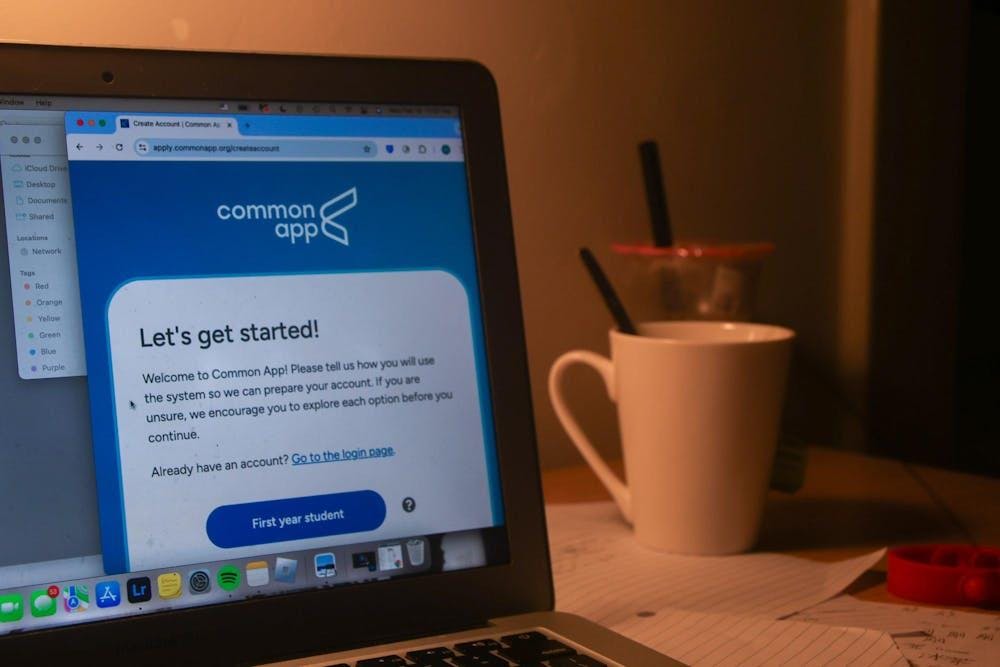 An open laptop displaying the Common App webpage.