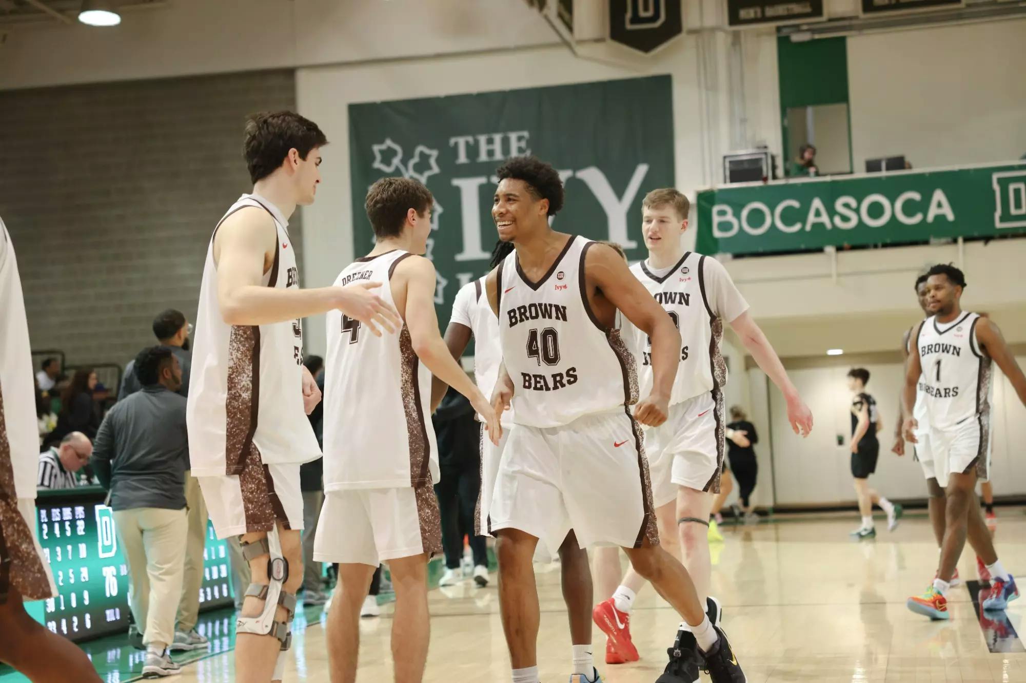 Photo of the Brown men’s basketball team celebrating after the game. 