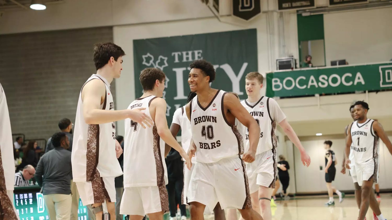 Photo of the Brown men’s basketball team celebrating after the game.