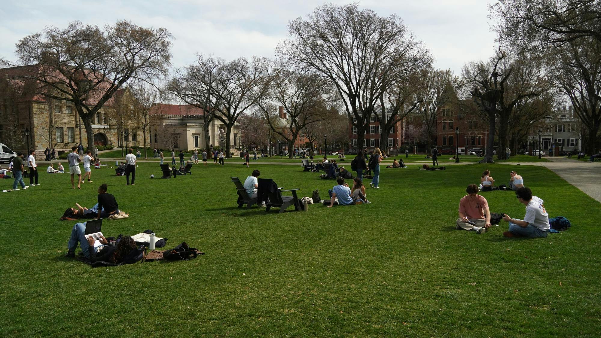A photo of students sitting on Brown's Main Green on a sunny day.