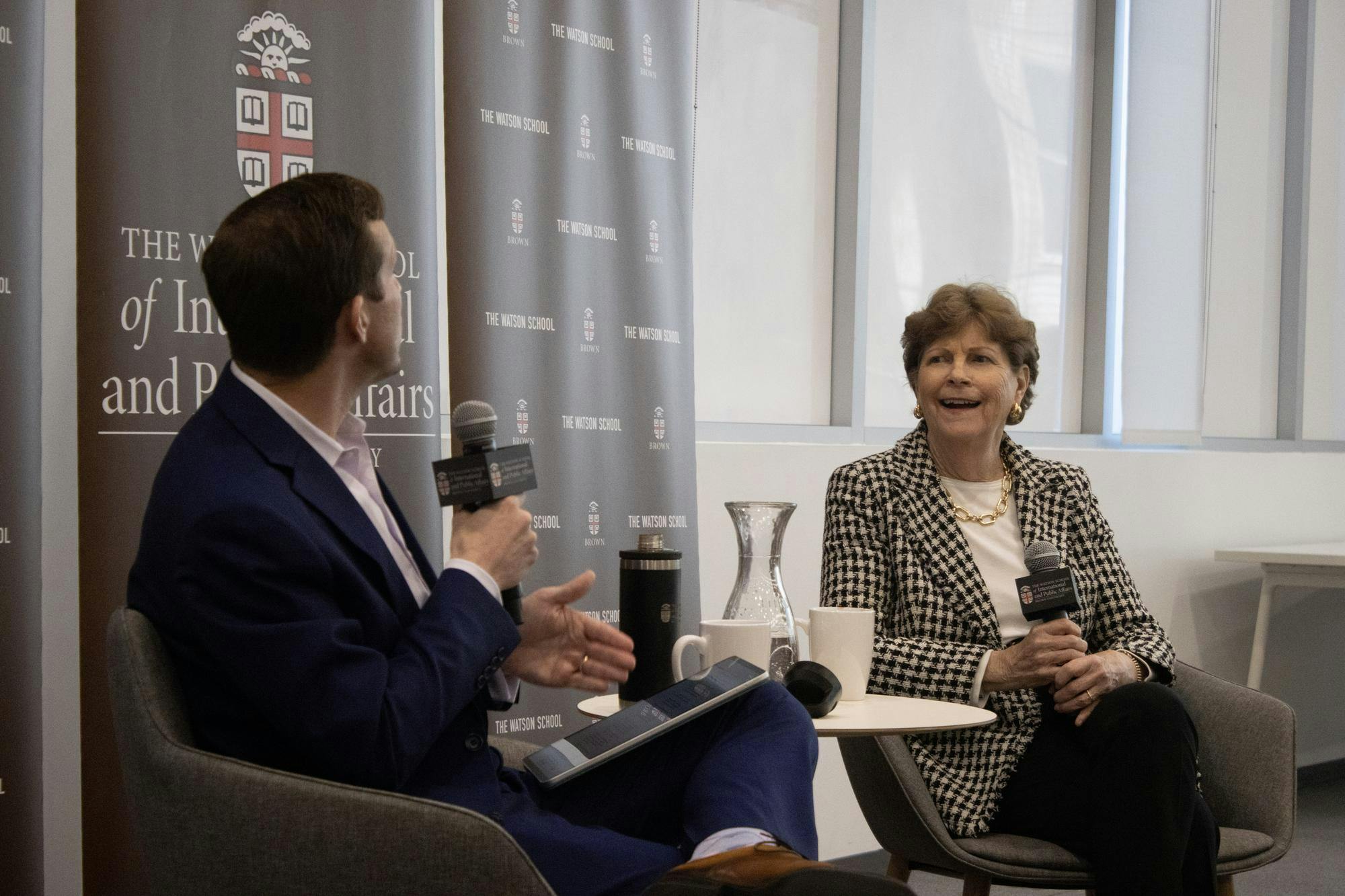A photo of John Friedman and Jeanne Shaheen speaking at the Watson Center for International and Public Affairs.