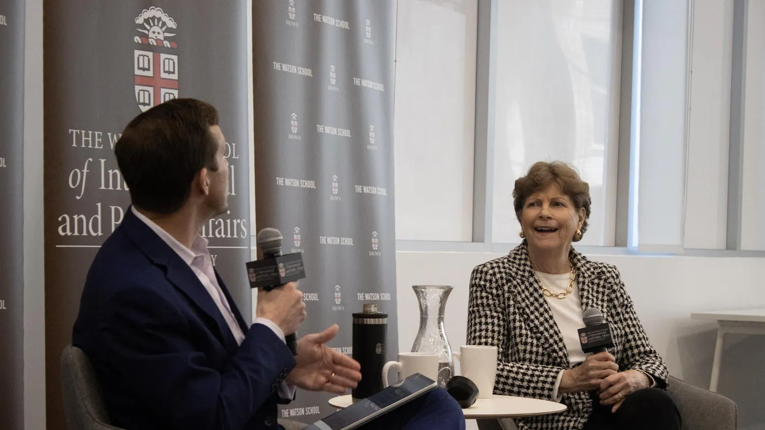 A photo of John Friedman and Jeanne Shaheen speaking at the Watson Center for International and Public Affairs.