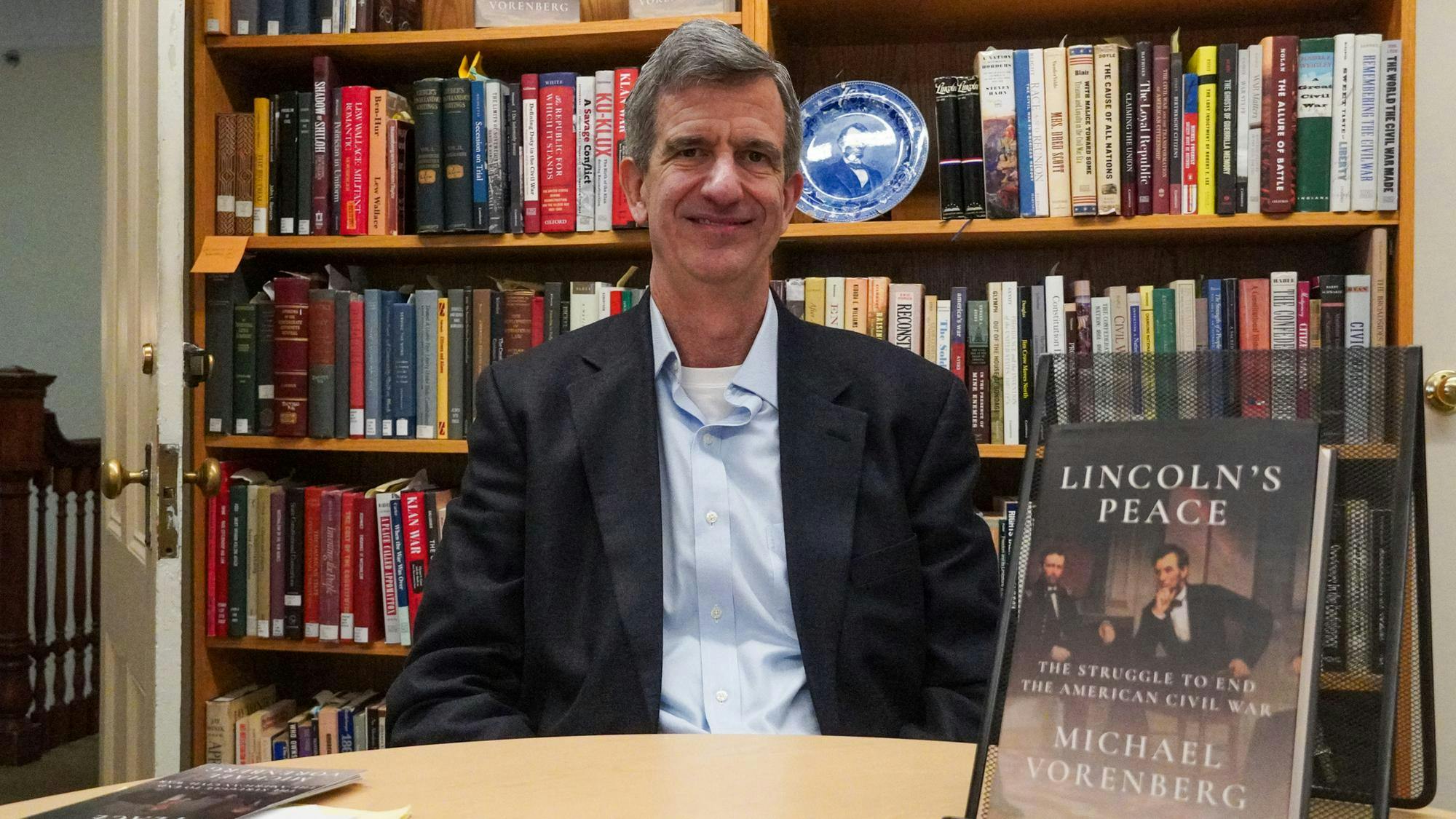 Photo of Michael Vorenberg in front of a bookshelf next to "Lincoln's Peace."