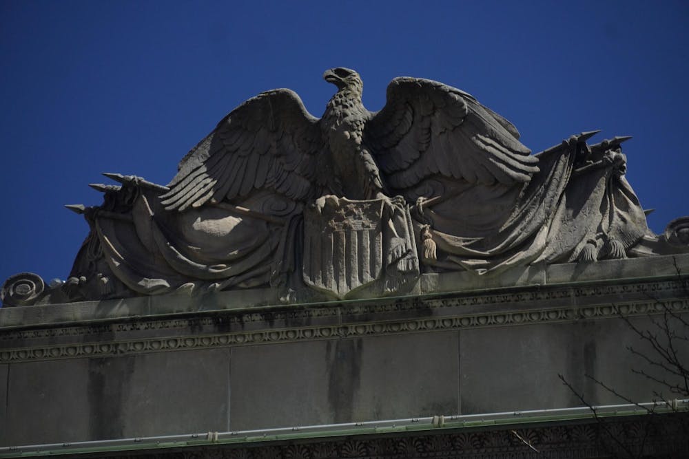 A photo of a bald eagle engraved into an arch located at Brown University.