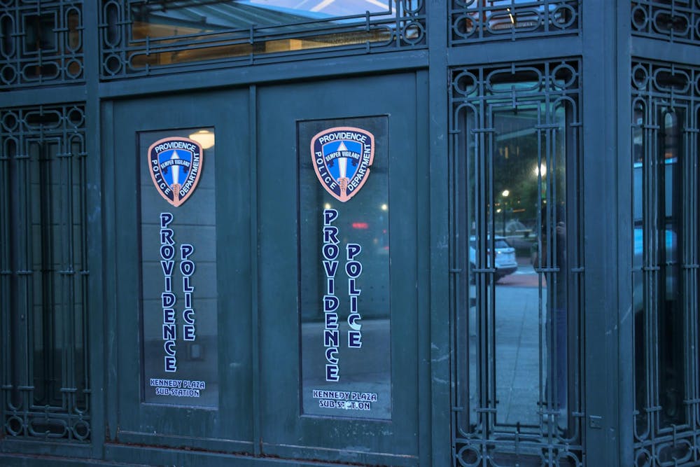 Photo of the Providence Police Department's Kennedy Plaza sub-station, an ornate black door with two police-department logos displayed on windowpanes.