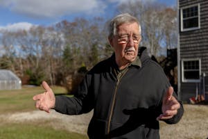 An old man opening her hands.