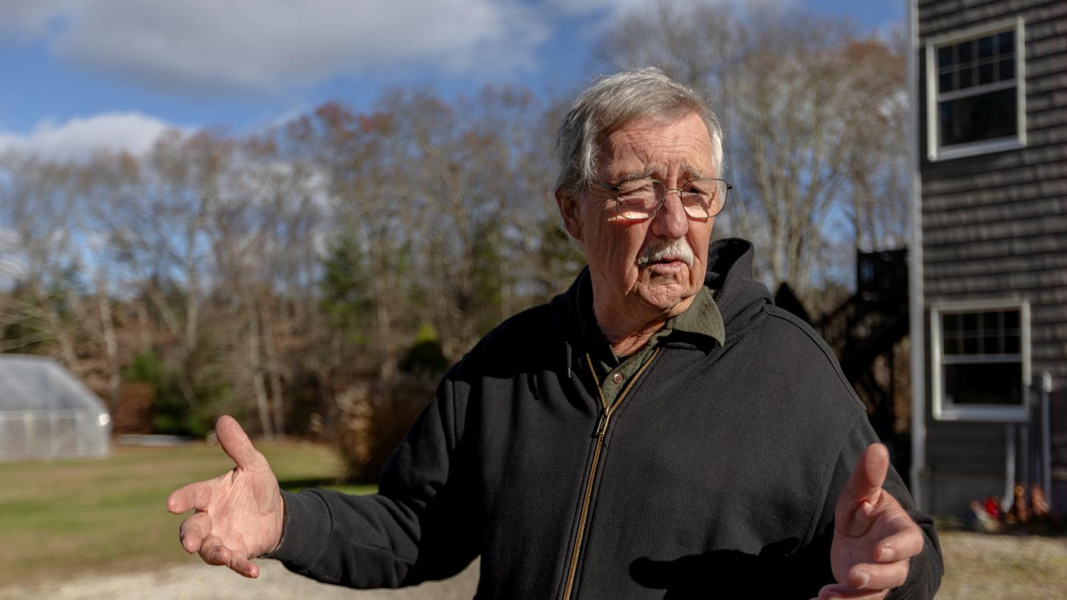 An old man opening her hands.