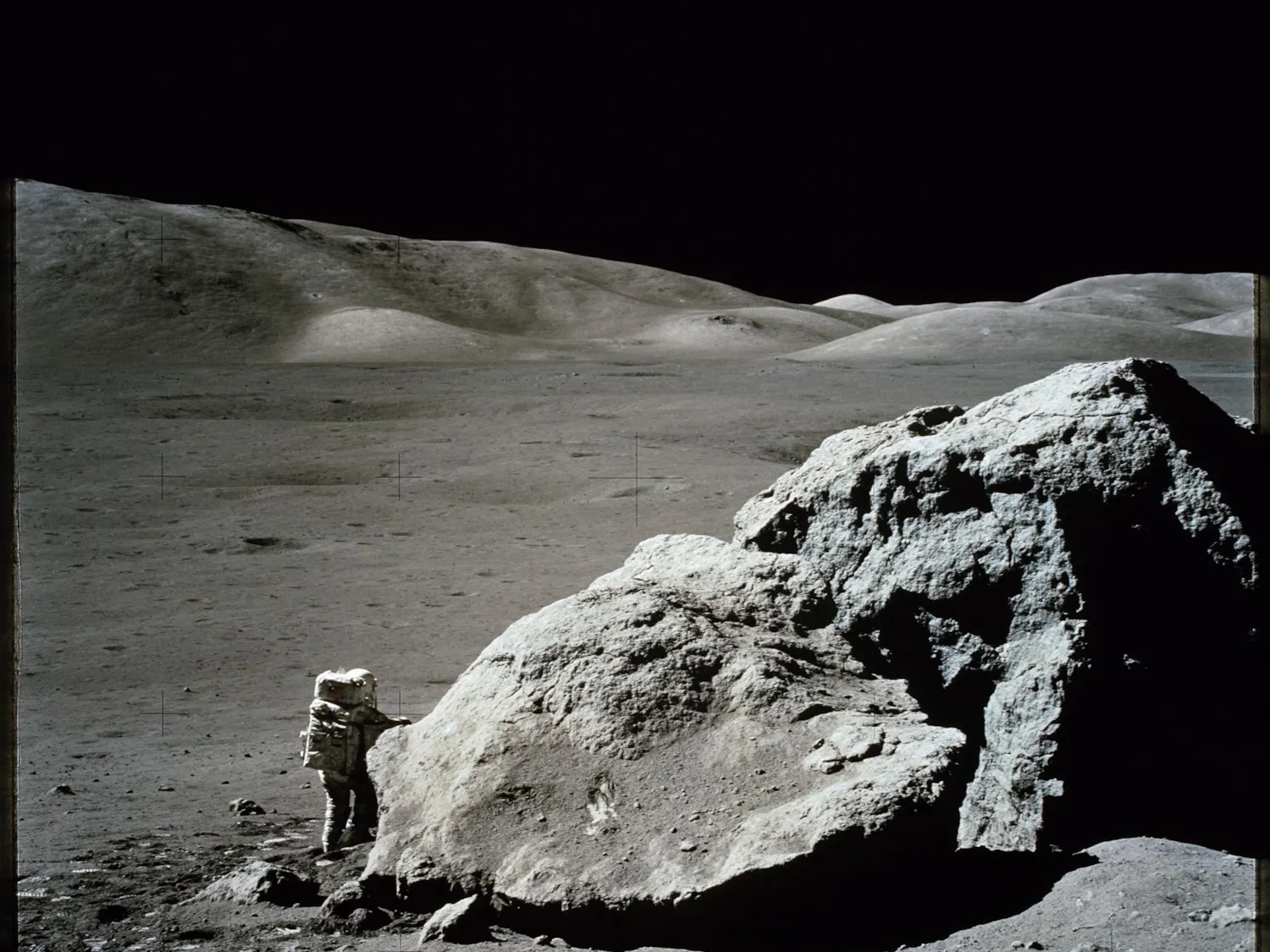 Photo of an astronaut conducting a spacewalk on the surface of the moon.